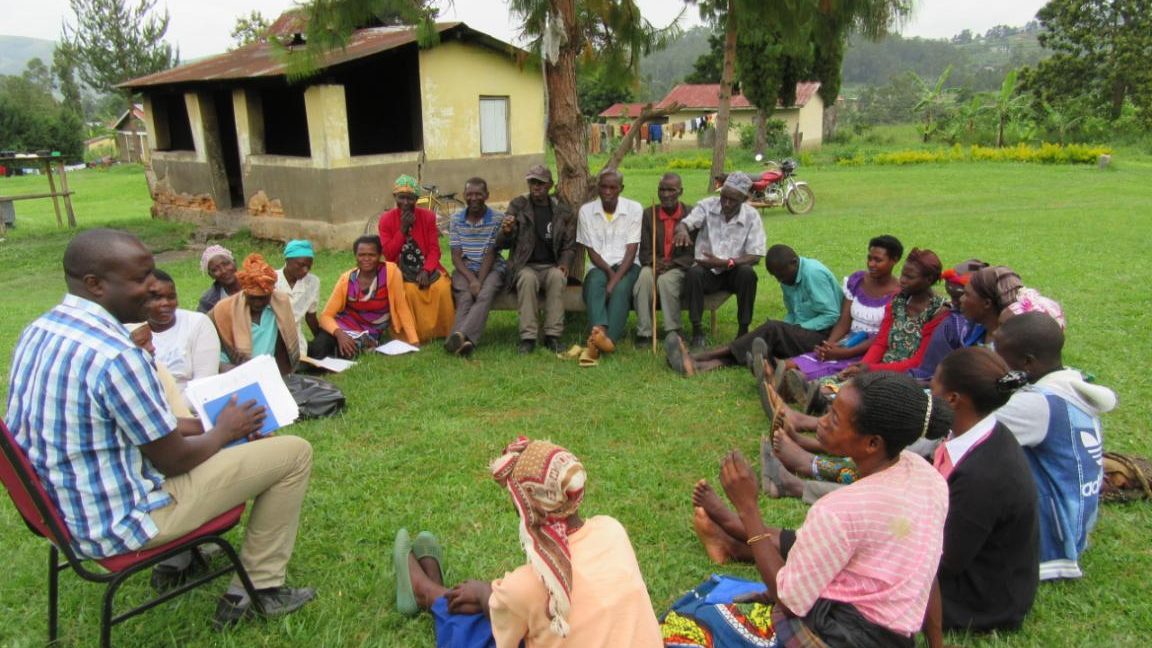COMEI staff conducting a community dialogue meeting in one sub county in Rukiga District